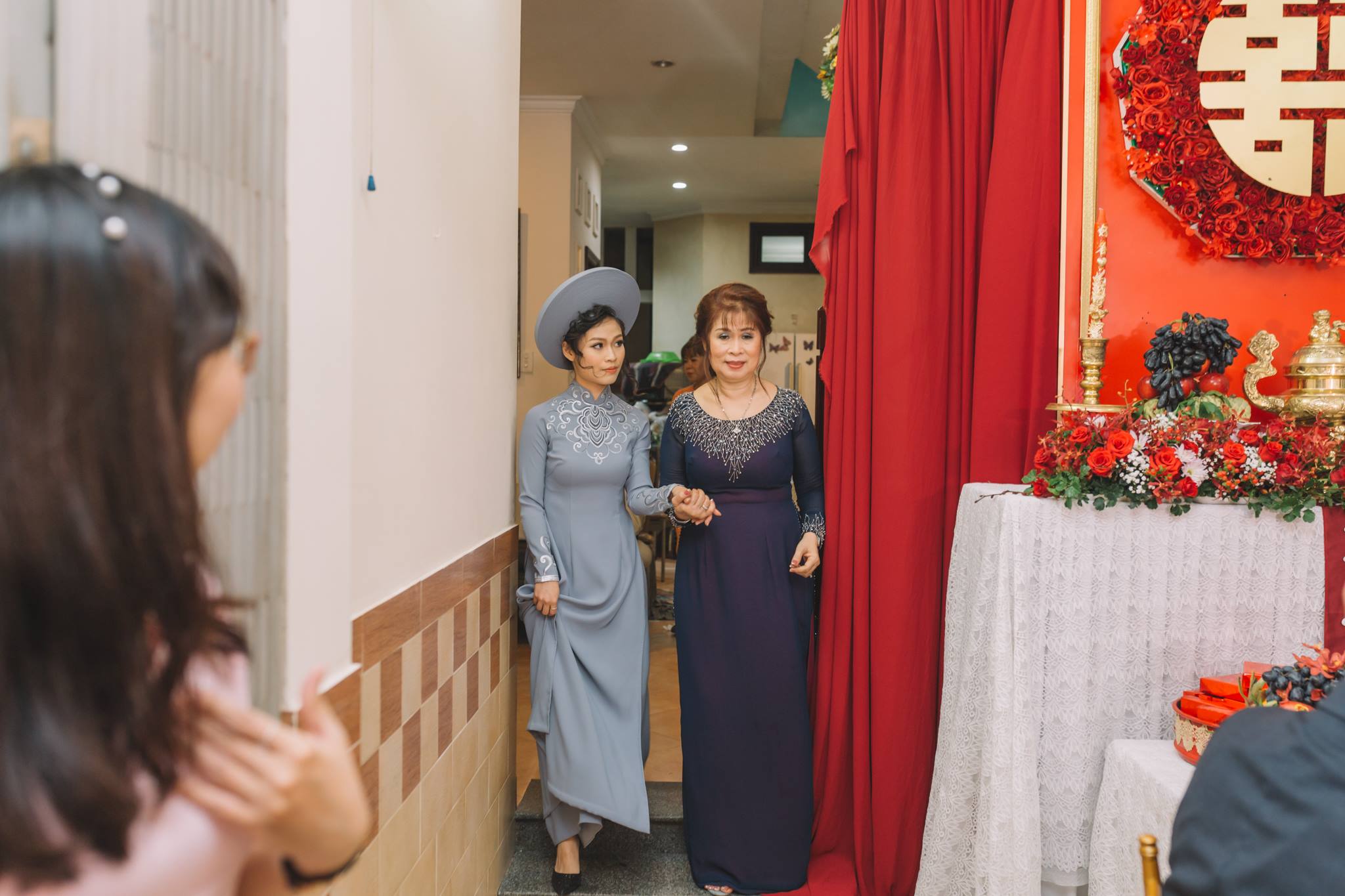 the bride’s mother will walk her daughter to the ceremony room and hand her over to the groom